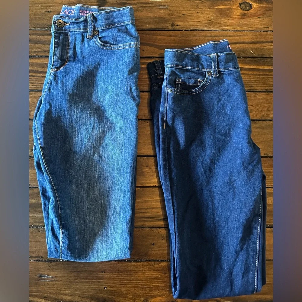 The Children’s Place girls jeans size 12. medium wash and dark wash 2 pairs!